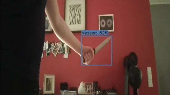 Live camera frame with one knife detected and an 82 percent displayed confidence score